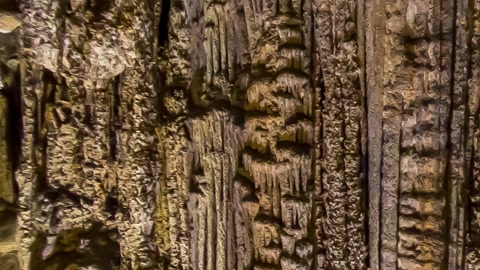 Illuminated cave with stalactites — Stillmotion