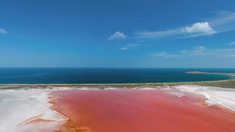 Red salt lake beside beach — Stillmotion