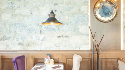 Elegant restaurant interior with tufted seating — Stillmotion