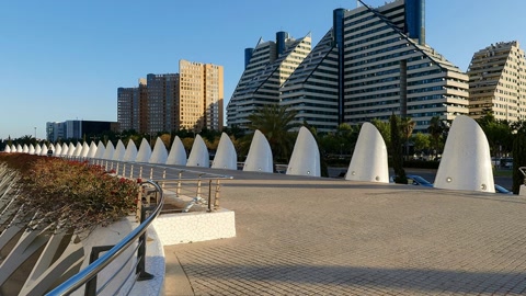 Modern waterfront promenade with geometric architecture — Stillmotion