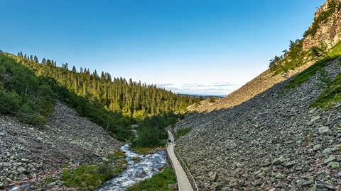 Rocky canyon with waterfall and stream — Stillmotion