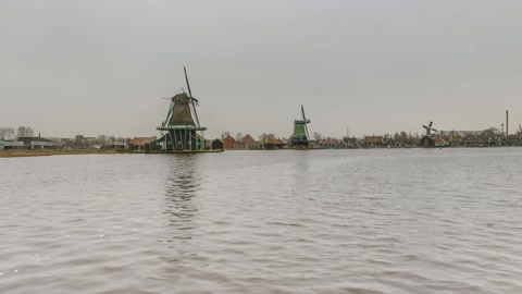 Windmill by the waterfront dock — Stillmotion