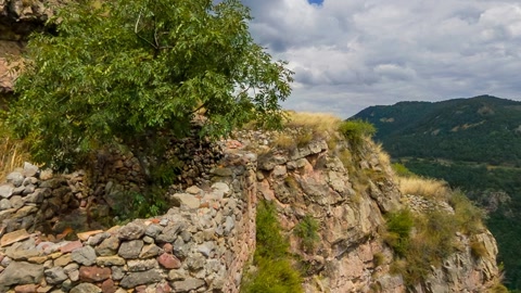 Mountain village under cloudy skies — Stillmotion