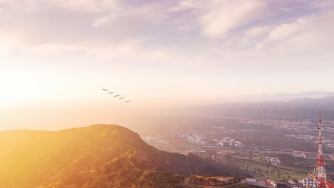 Sunset sky over city and hills — Stillmotion