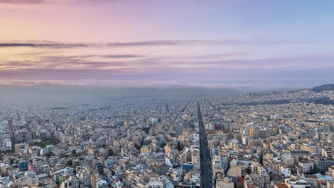 Dense cityscape with hillside village — Stillmotion