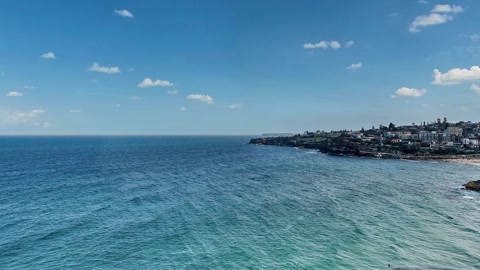 Coastal town and rocky shoreline — Stillmotion