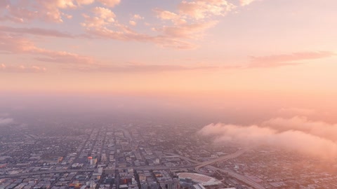 City under glowing sunset sky — Stillmotion
