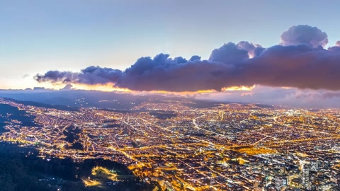 Volcano ridge above city lights — Stillmotion