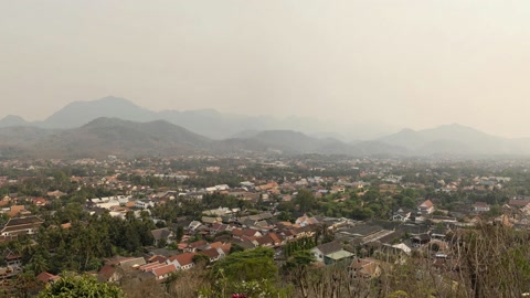 Hilltop view over village and river — Stillmotion