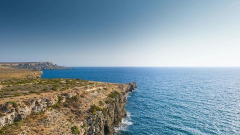 Rocky coastal cliffs and sea inlet — Stillmotion