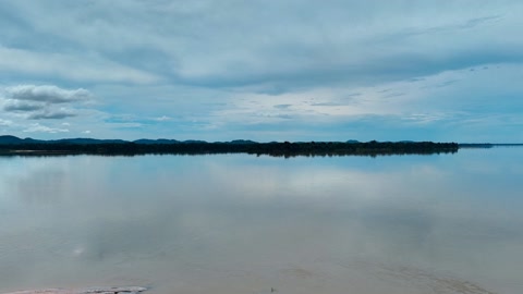 Lagoon with cloudy skies and sculpture — Stillmotion