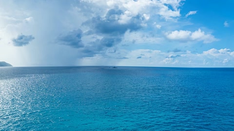 Cloudy coastal island and open sea — Stillmotion
