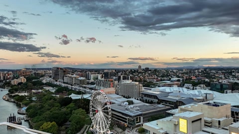 City skyline at sunset under clouds — Stillmotion