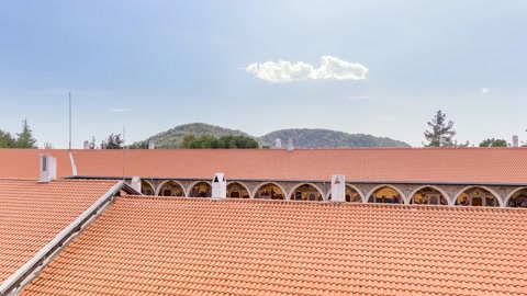 Monastery complex on forested hillside — Stillmotion