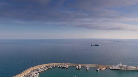 Aerial coastal city and marina — Stillmotion