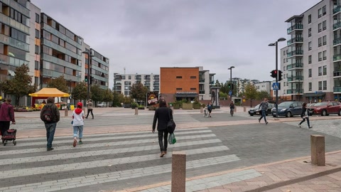 Urban plaza with shops and pedestrians — Stillmotion