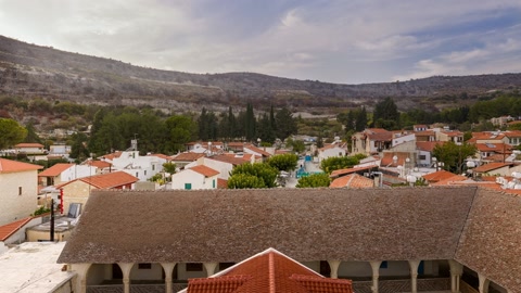 Village rooftops and mountain valley — Stillmotion