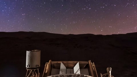 Starry night sky over dark terrain — Stillmotion