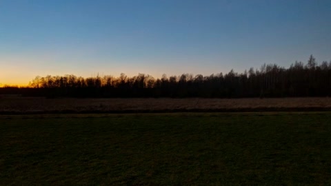 Cabin beside open grassy field — Stillmotion