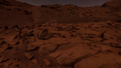 Rocky desert under starry night sky — Stillmotion