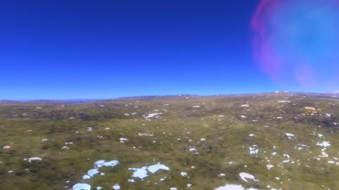 Sparse tundra under clear sky — Stillmotion