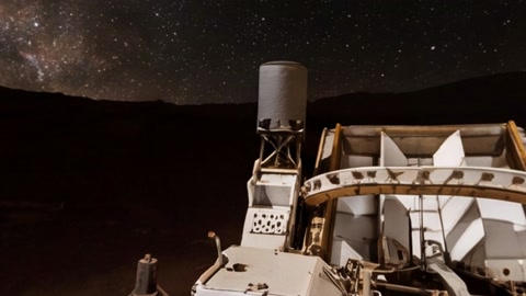 Mars rover at night under starry sky — Stillmotion