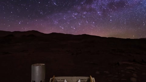 Starry night sky over dark terrain — Stillmotion