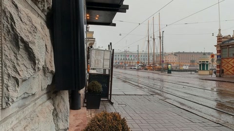 Rainy street by brick market hall — Stillmotion