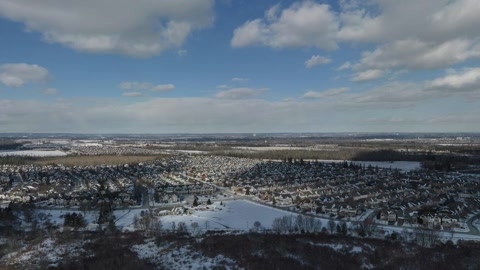 Snowy lakeshore and coastal town — Stillmotion
