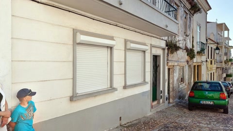 Cobblestone alley with tiled facades — Stillmotion