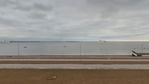 Cloudy coastal promenade with fortifications — Stillmotion