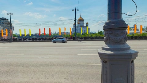 Riverside promenade with road and flags — Stillmotion