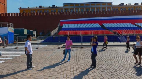 Crowded plaza with historic buildings — Stillmotion