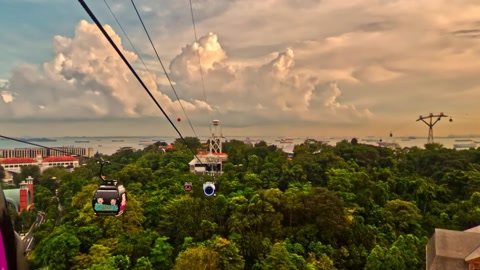 Cable car over tropical waterfront resort — Stillmotion