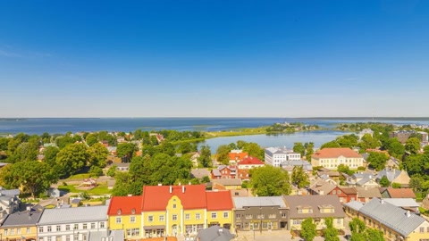 Aerial view over coastal town — Stillmotion