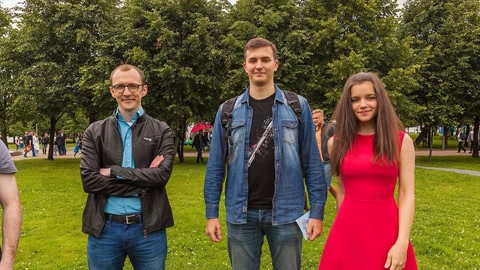 People gathered in park on cloudy day — Stillmotion