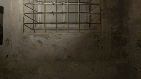 Prison cell interior with barred windows — Stillmotion