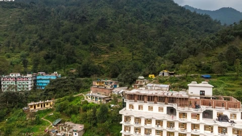 Mountain village with hillside apartments — Stillmotion