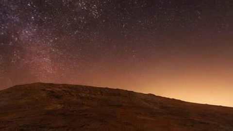 Starry night over rocky badlands — Stillmotion