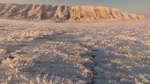 Frozen snowfield at sunset — Stillmotion