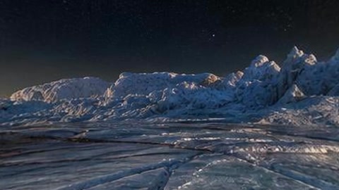 Frozen icy landscape under starry sky — Stillmotion
