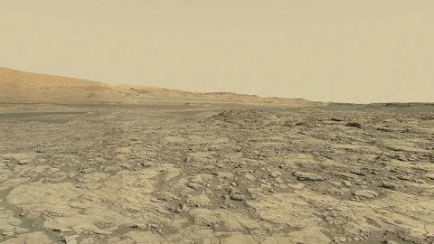 Rocky desert terrain with sand dunes — Stillmotion