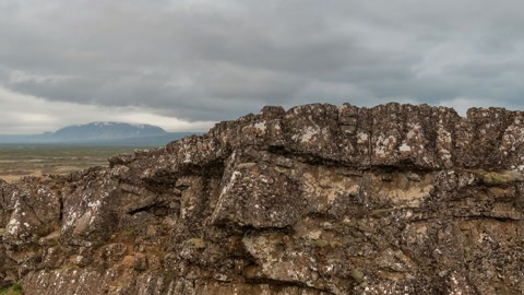 Rocky cliff with waterfall and river — Stillmotion