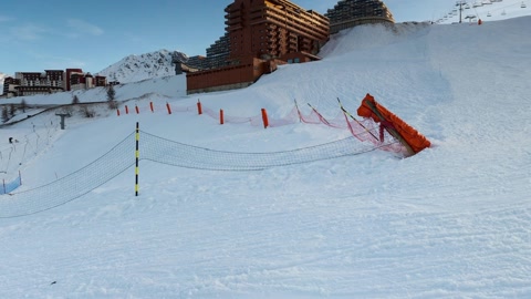 Ski slope with mountain resort buildings — Stillmotion