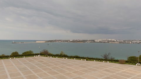 Coastal plaza with monument view — Stillmotion