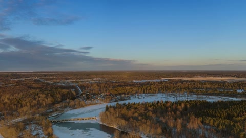 Snowy marsh with forest and waterways — Stillmotion