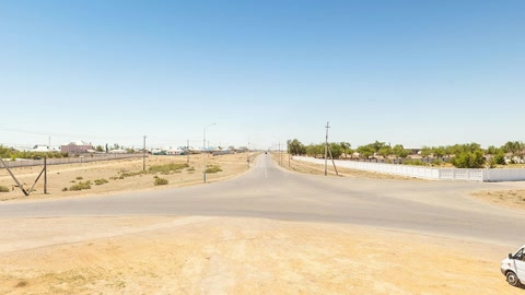Sandy desert road with memorial mural — Stillmotion