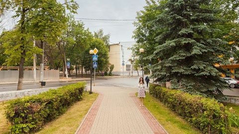 Tree-lined park with statues — Stillmotion