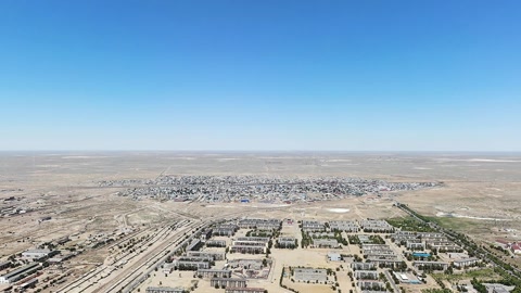 Aerial view of desert city and river — Stillmotion