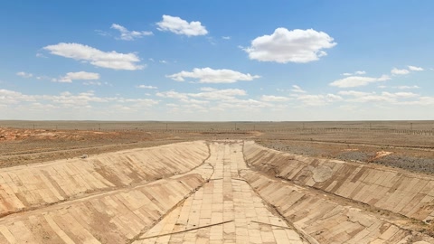 Open pit construction site with heavy machinery — Stillmotion